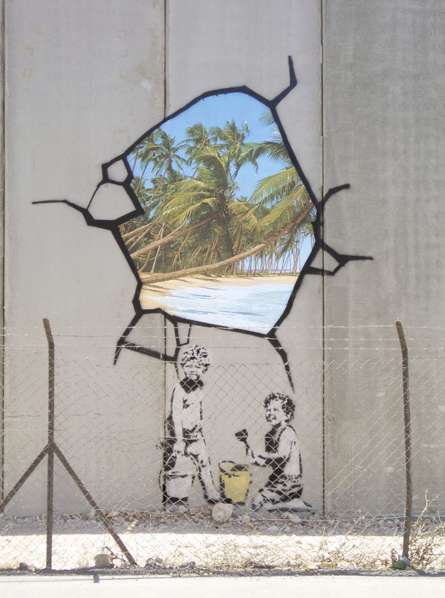 A Banksy trompe-l&apos;oeil painting on a security fence in the West Bank.